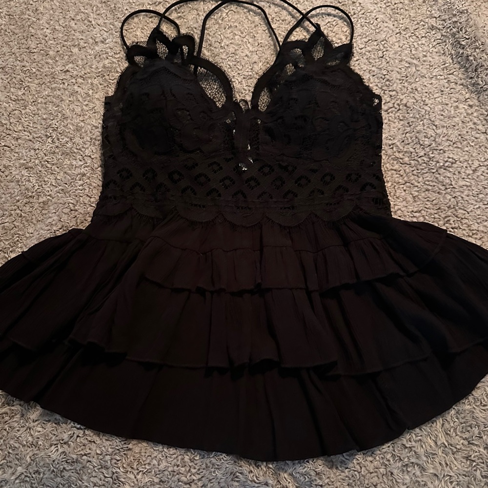 NWOT! Large, front enhancing blouse.